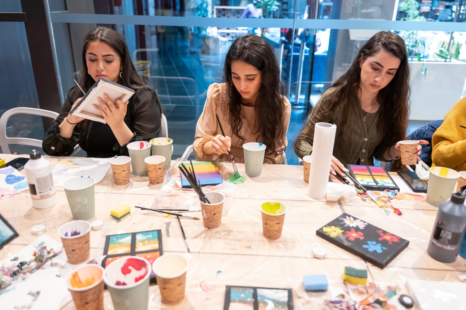 Young women with their paintings